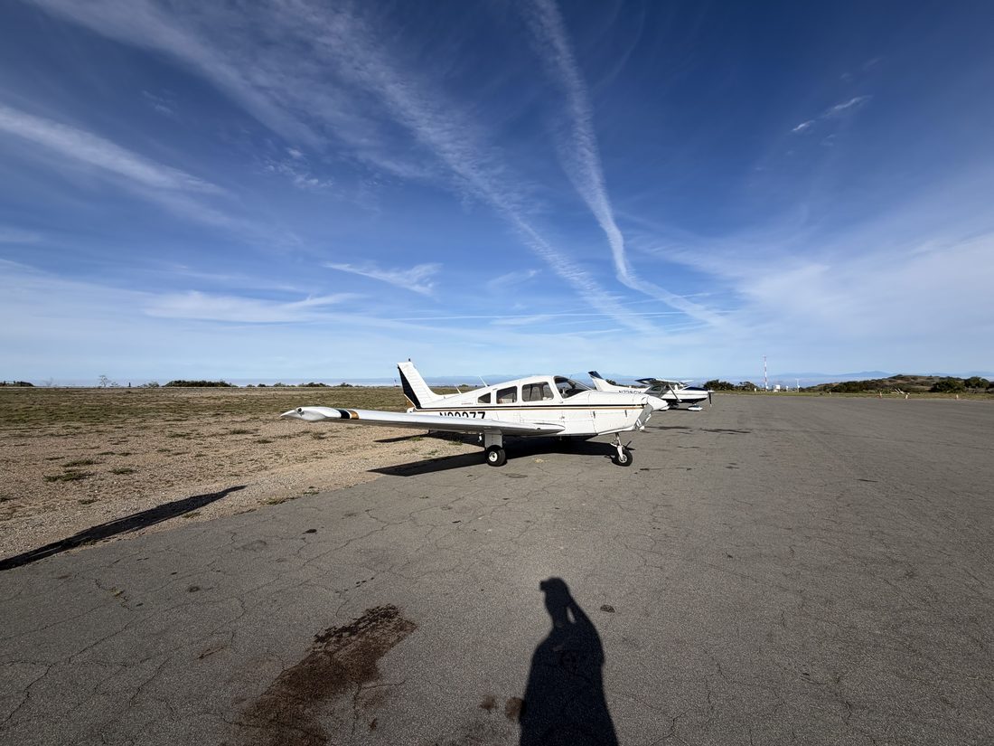 N2227Z parked at a coastal airstrip on a clear day